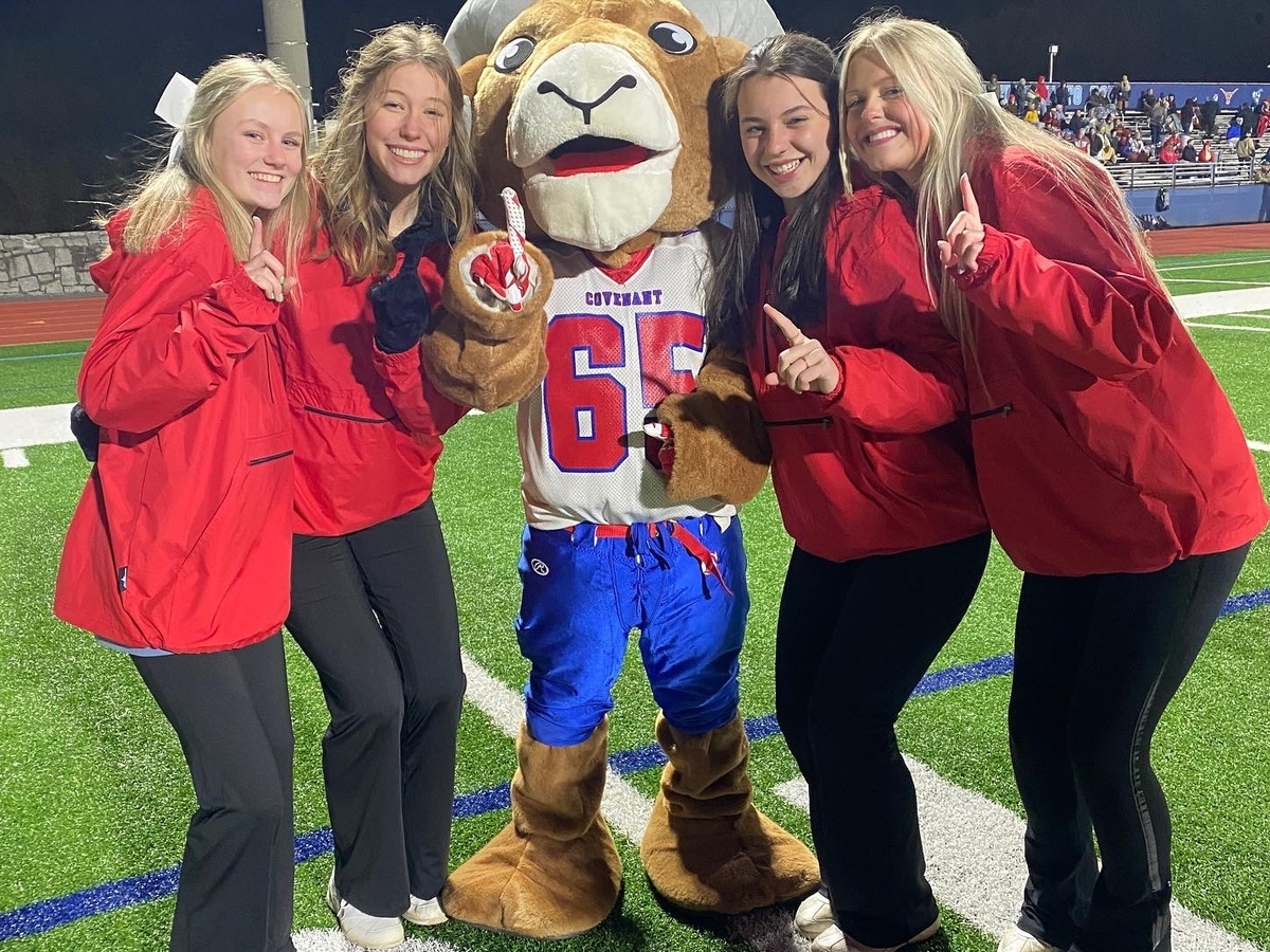 ram mascot with cheerleaders