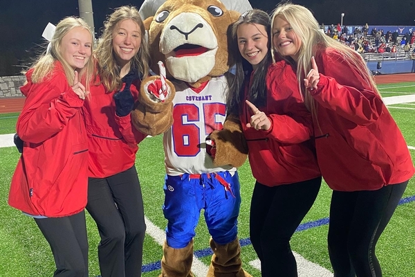 ram mascot with cheerleaders