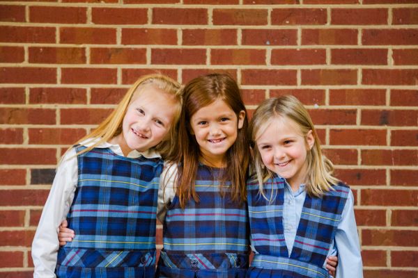 Three young female students smiling