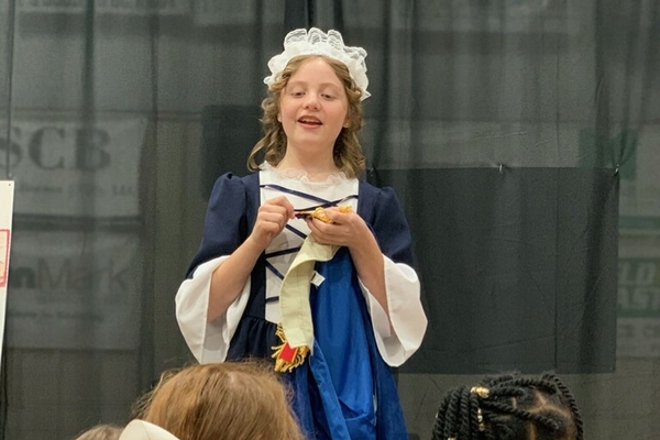 student performing at wax museum