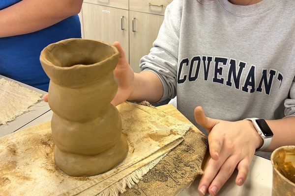 pottery student in art class