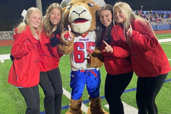 Varsity Cheerleaders and Ram Mascot