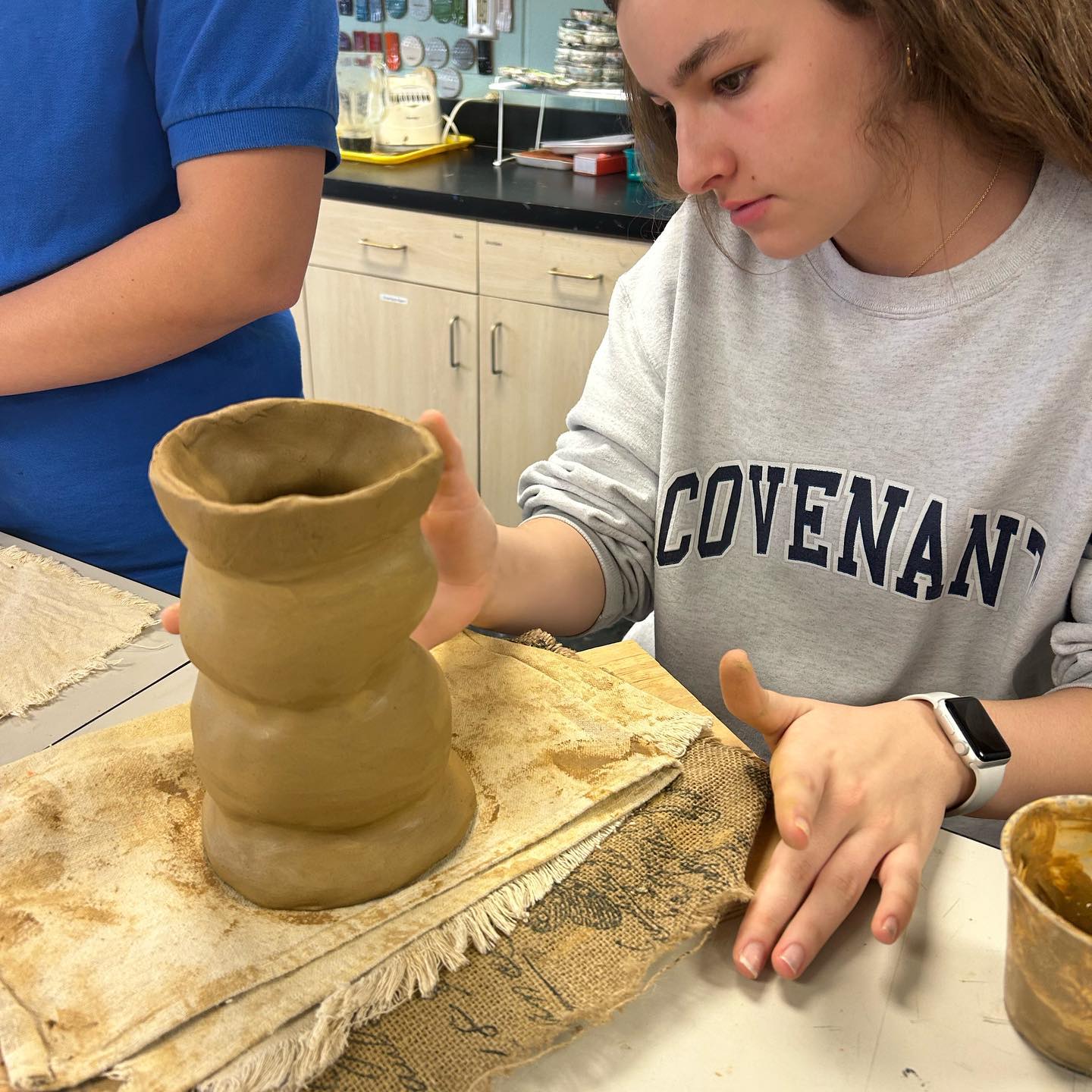 Student working with clay