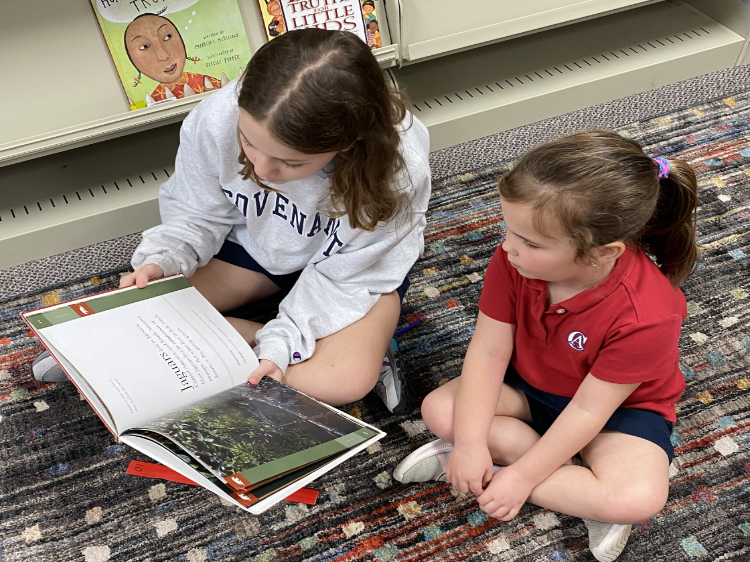 Students reading together in the library